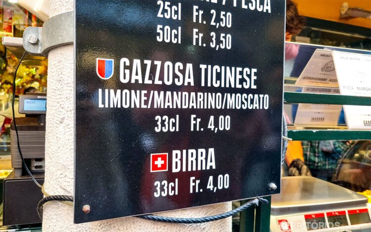 Placa preta mostra preços de bebidas em loja na Suíça